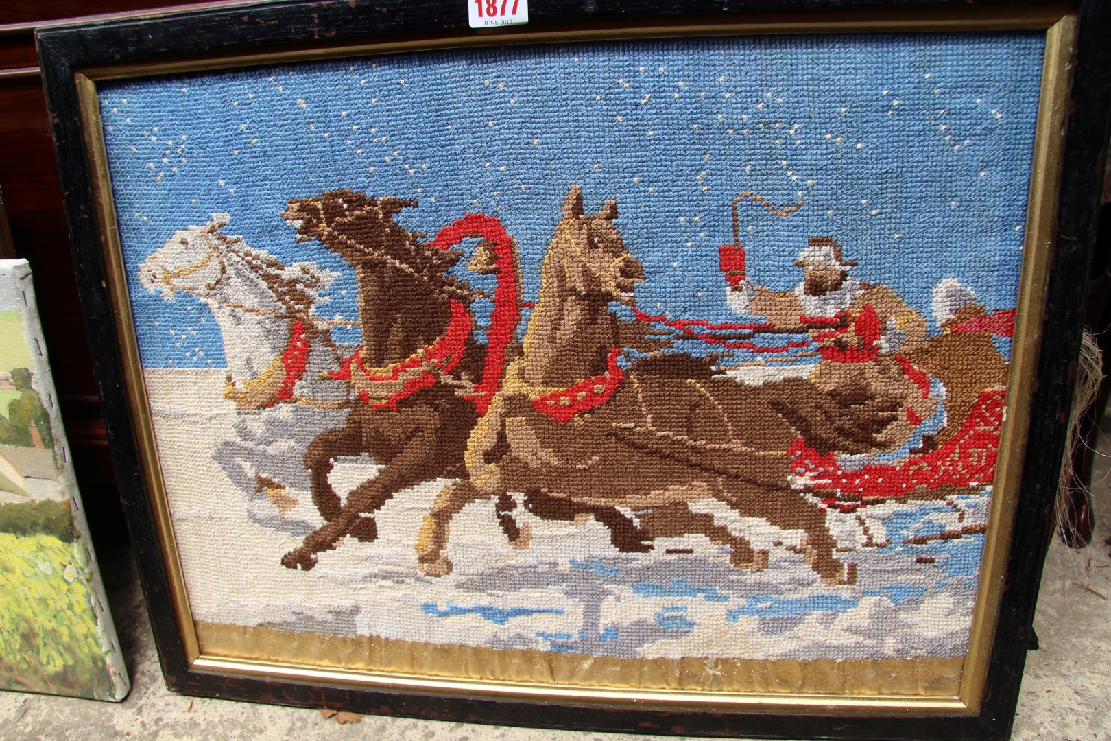 A tapestry of a horsedrawn sleigh, probably Russian, 37 x 53cm.