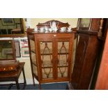 A circa 1900 mahogany and satinwood crossbanded display cabinet, 114.5cm wide.