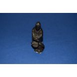 A Chinese bronze figure of Guanyin, 18th century, 8cm high.