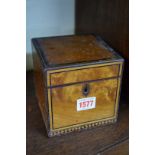 A George III satinwood and inlaid tea caddy, 12.