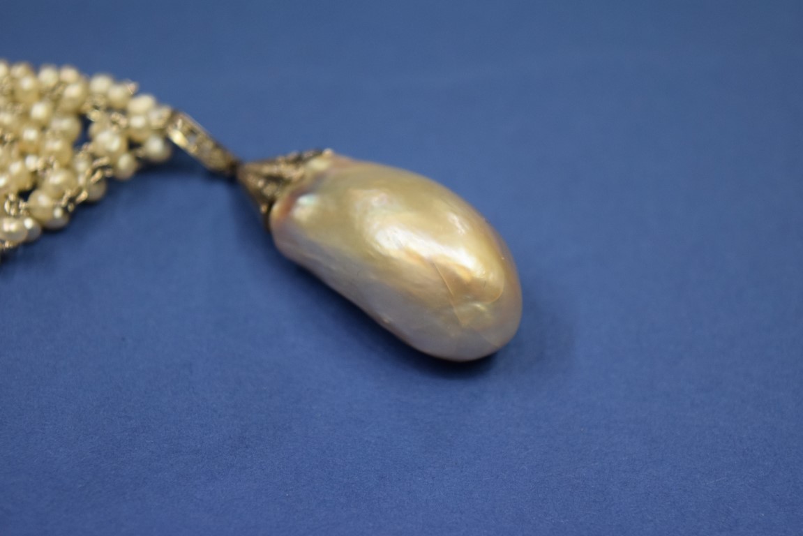 A large Baroque pearl in a mine cut diamond set mount on an associated four strand freshwater pearl - Image 15 of 19