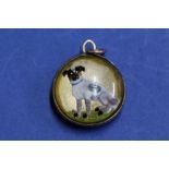 A rock crystal intaglio pendant of a hunting dog in a 9ct mount.