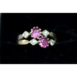 An unmarked ring set rubies and diamonds.