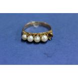 An unmarked gold and pearl ring, (a/f).