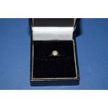 An 18ct gold diamond solitaire ring.