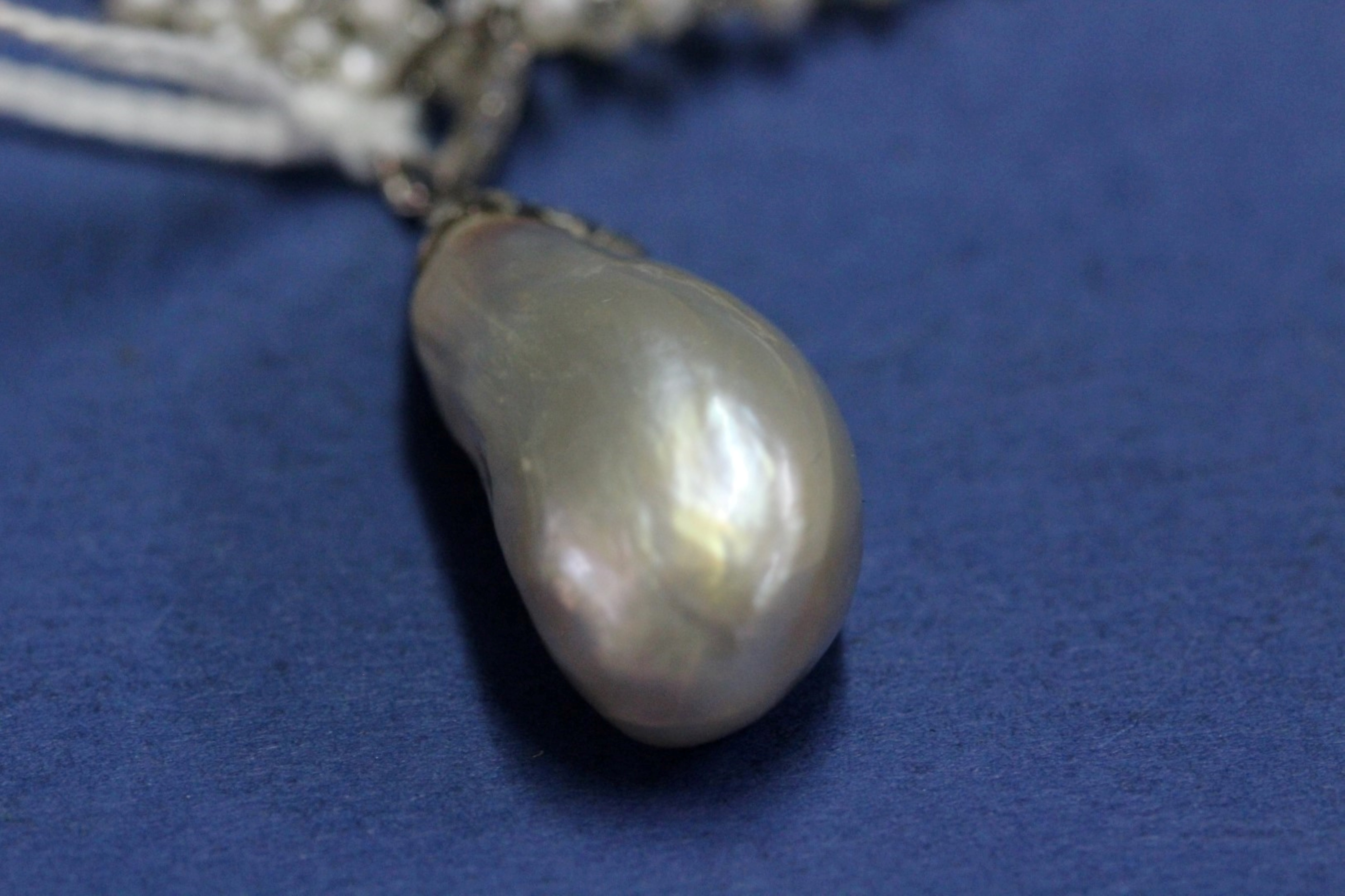 A large Baroque pearl in a mine cut diamond set mount on an associated four strand freshwater pearl - Image 2 of 19