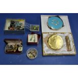 A boxed Goya Golden Girl powder compact and lipstick holder; together with one other example;