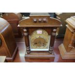 An old oak mantel clock, 37.5cm high.