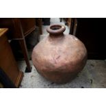 An oversized leather vase or amphora, 58cm high.