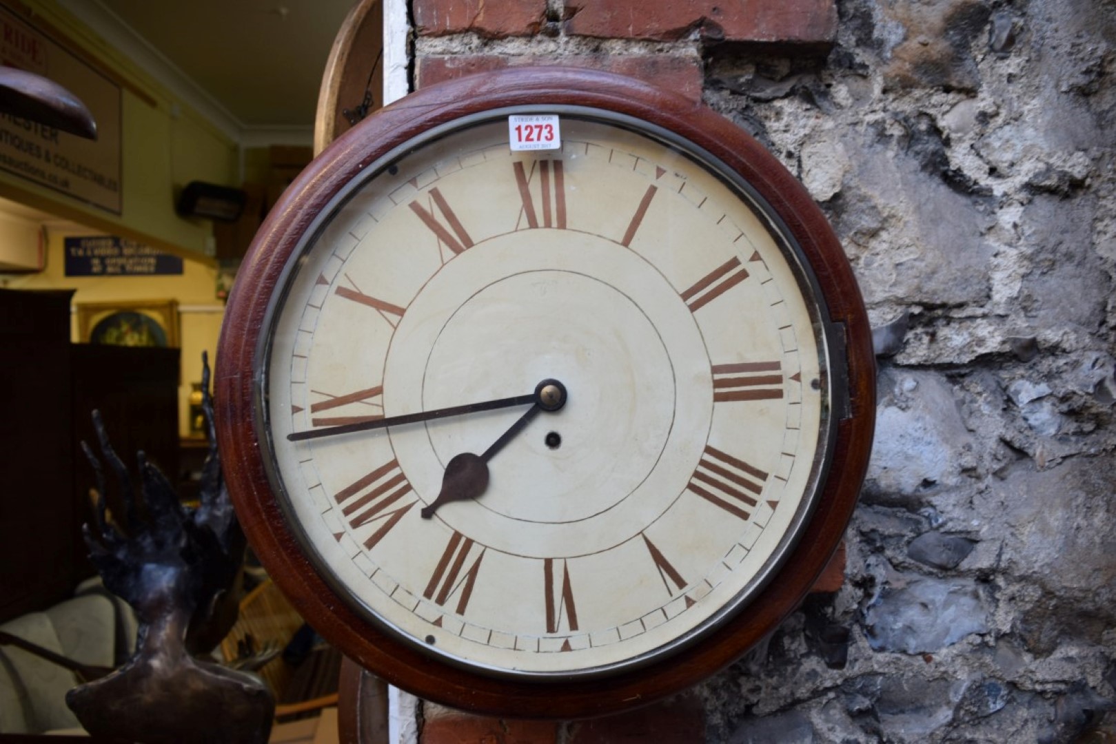 A 19th century mahogany circular wall clock, with 14in dial and fusee movement.