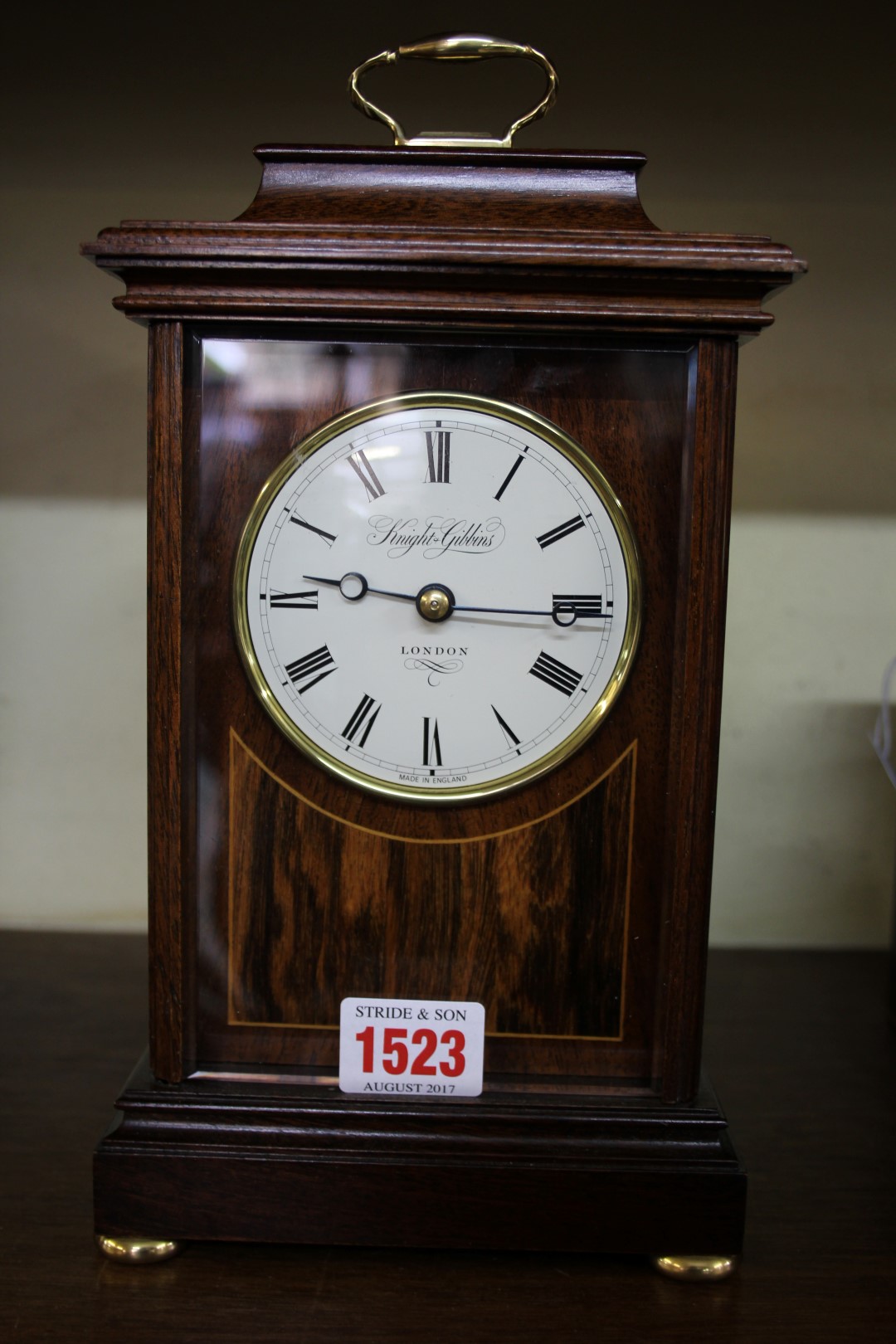 A good reproduction mahogany mantel clock, the circular enamel dial inscribed 'Knight Gibbins,