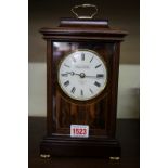 A good reproduction mahogany mantel clock, the circular enamel dial inscribed 'Knight Gibbins,