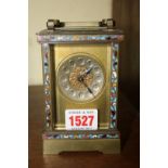An old brass and champleve enamel carriage timepiece, height including handle 15.5cm.