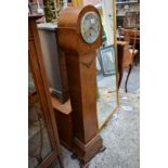 A 1930s walnut small longcase clock, 145cm high.