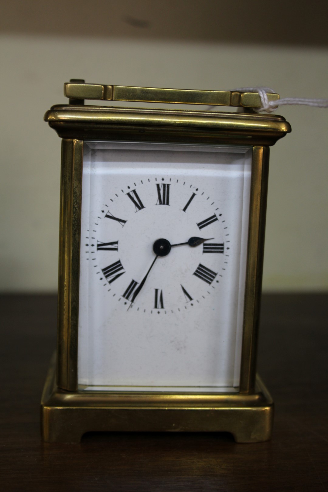 An old brass carriage timepiece, height including handle, 15cm.