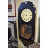 An antique Continental papier-mache wall clock, 78cm high.