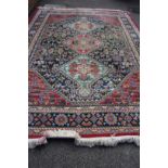 A Southern Persian design carpet, with three medallions and geometric motifs with birds in field,