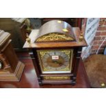 A circa 1900 century oak and brass mounted mantel clock, striking on two gongs, 37.5cm high.