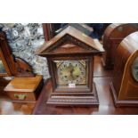 A late 19th century carved walnut mantel clock, with pointed arched top, 38cm high.