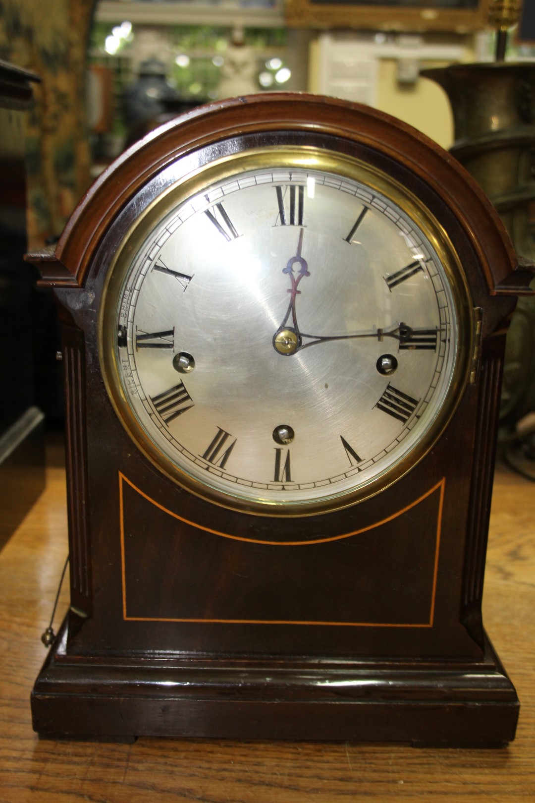 A late 19th/early 20th century mahogany dome top mantel clock, with Westminster chime, 32cm high.