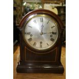 A late 19th/early 20th century mahogany dome top mantel clock, with Westminster chime, 32cm high.