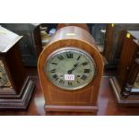 A late 19th century mahogany and line inlaid dome top mantle clock, chiming on five straight gongs,