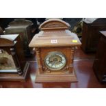 An old oak mantel clock, 42cm high.