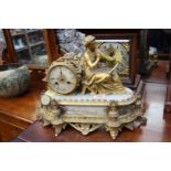 A late 19th century gilt metal and alabaster mantel clock, 38cm wide.