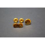 Five 18ct gold dress studs and a leather stud box, 5g.