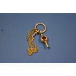 An unmarked fancy watch key set ruby and agate,