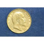 An Edward VII 1903 gold sovereign.