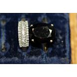 A 9ct gold three row ring set diamonds; together with a 9ct gold and oval dark smokey quartz ring.