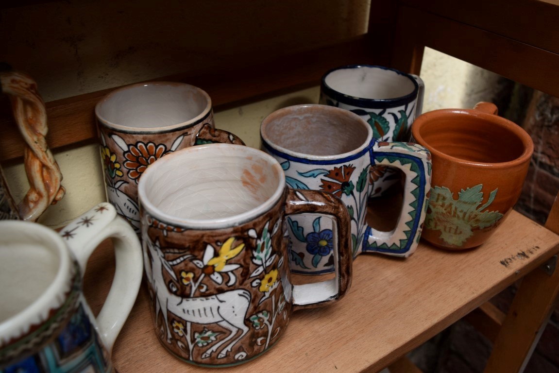 Seven Iznik and Jerusalem mugs; together with a stein; and a clear glass decanter and stopper. - Image 6 of 6