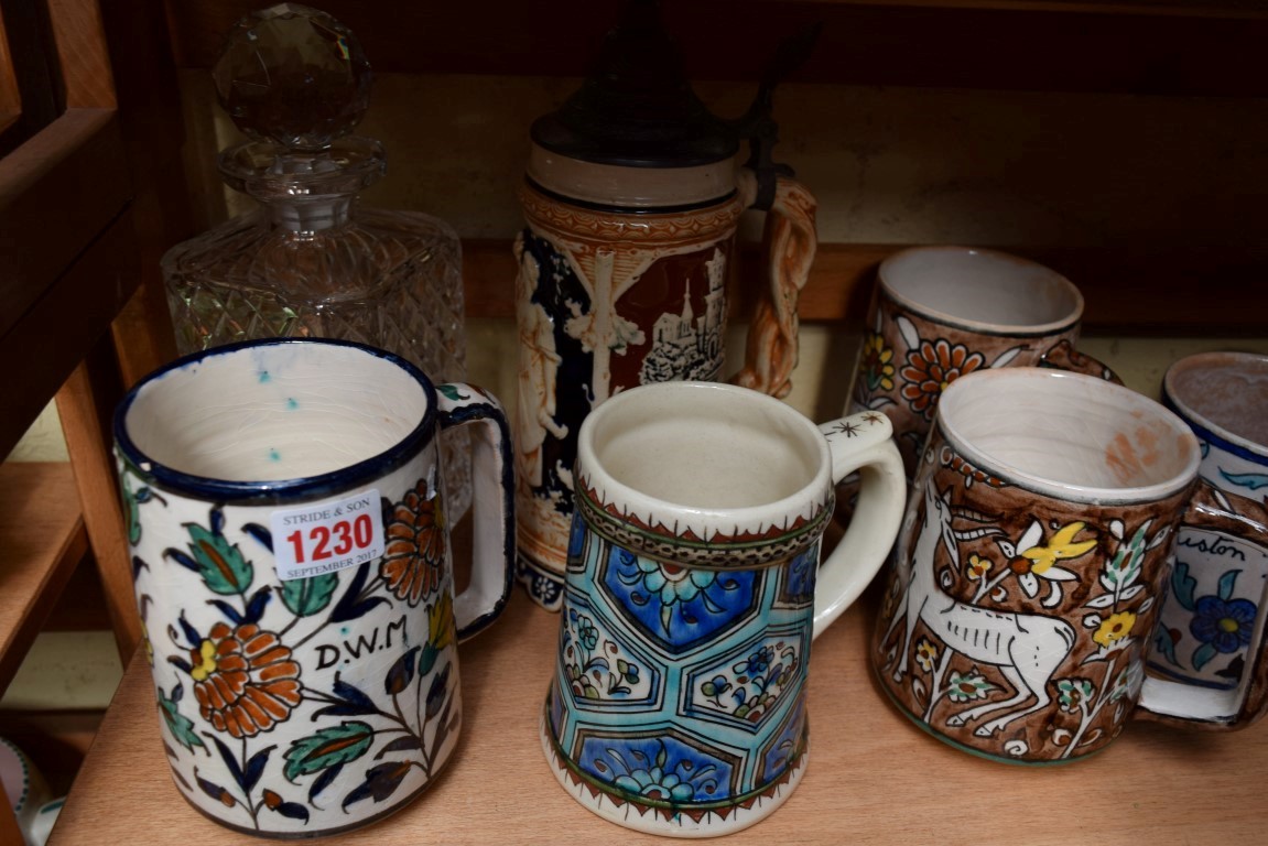 Seven Iznik and Jerusalem mugs; together with a stein; and a clear glass decanter and stopper. - Image 4 of 6