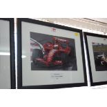 Formula One: a signed photograph of Kimi Raikkonen in Grand Prix car, 19.5 x 29.5cm.