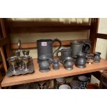 A collection of pewter baluster measures; together with an electroplated egg cruet; etc.