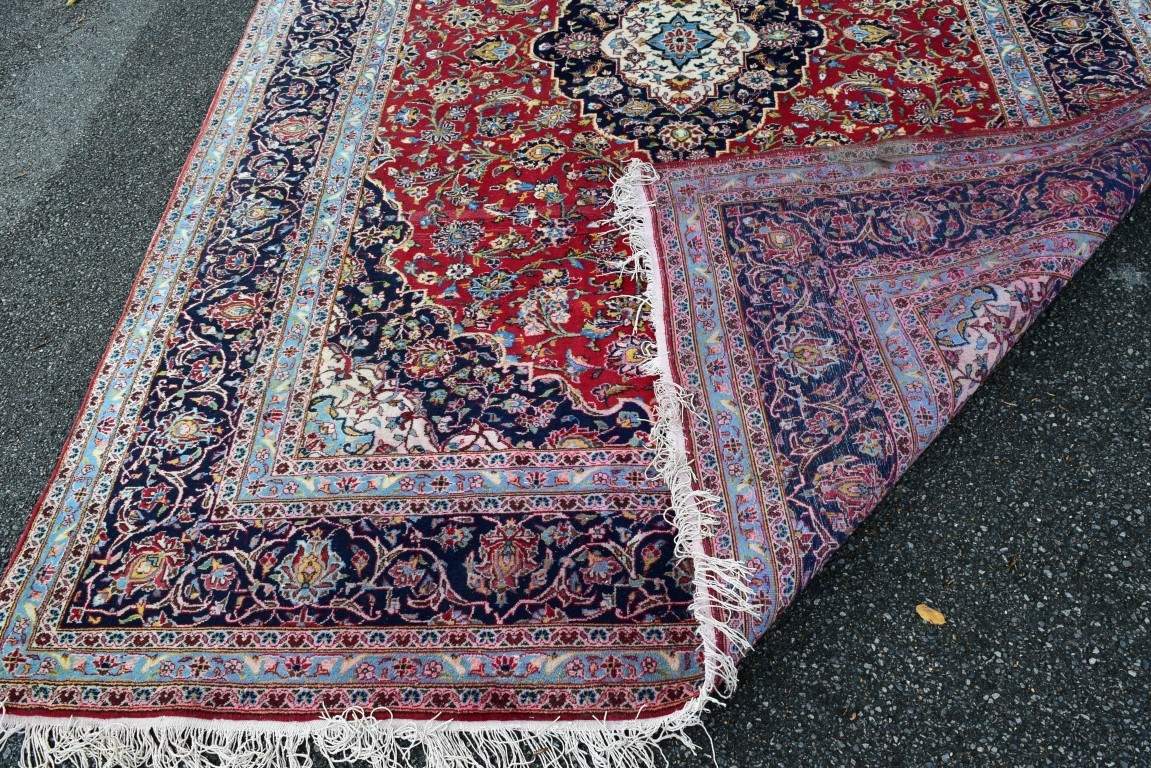 A Persian 'Kashan' carpet, with large coastal medallion on a floral red field, 352 x 251 cm. - Image 10 of 10