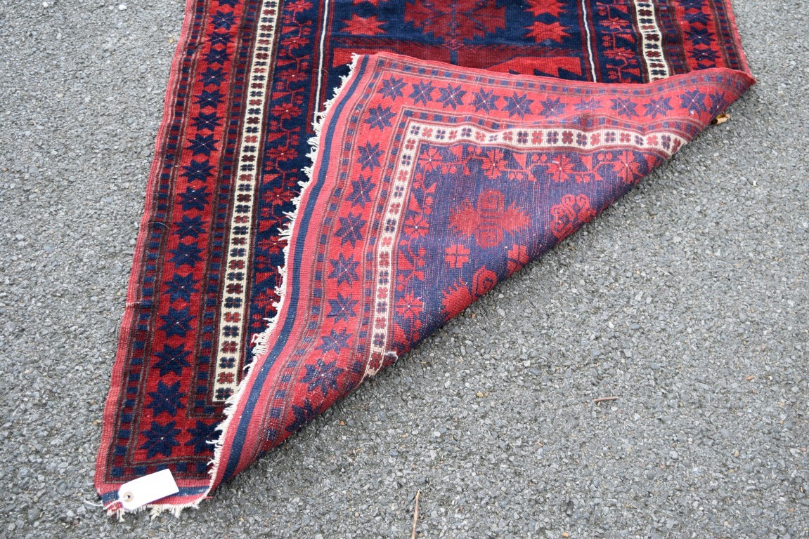 A Turkish 'Yagcibedir' rug, with large central medallion on a stylised floral blue field, - Image 4 of 4