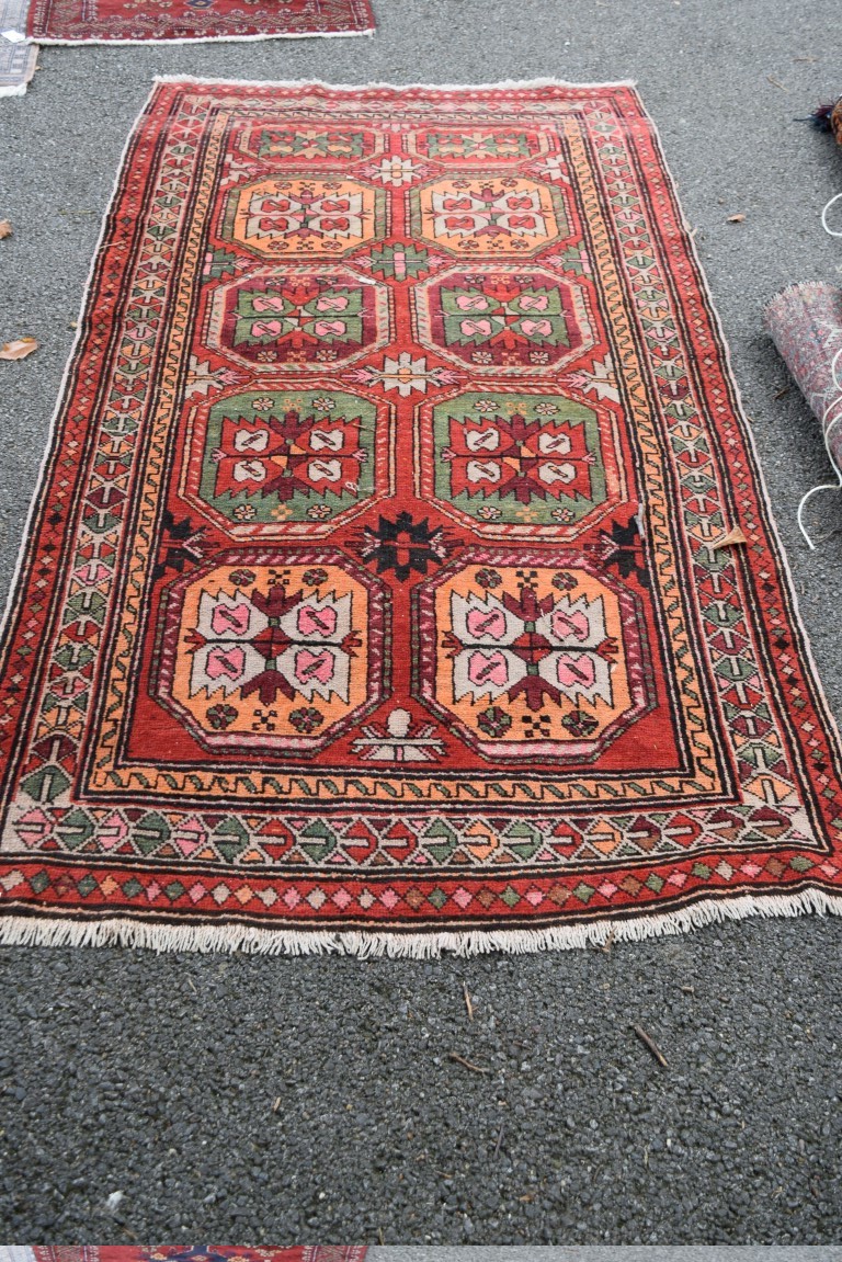 A Persian Hamadan rug, with an all over large geometric motif design, 227 x 115cm.