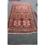 A Persian Hamadan rug, with an all over large geometric motif design, 227 x 115cm.