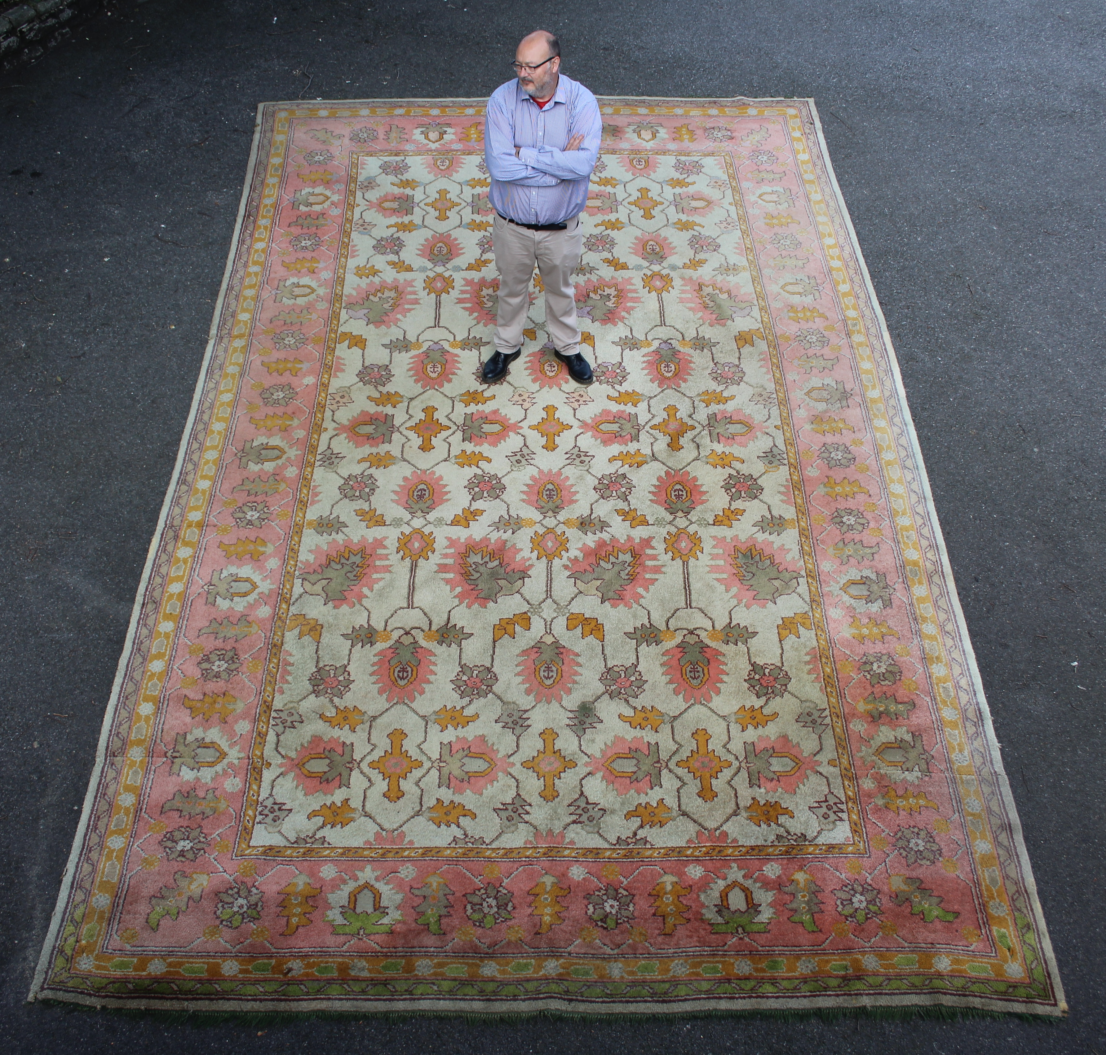 A very large ivory field Ushak design carpet, probably woven in Donegal, Ireland,