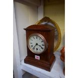 An old oak timepiece; together with a gilt gesso framed engraving.