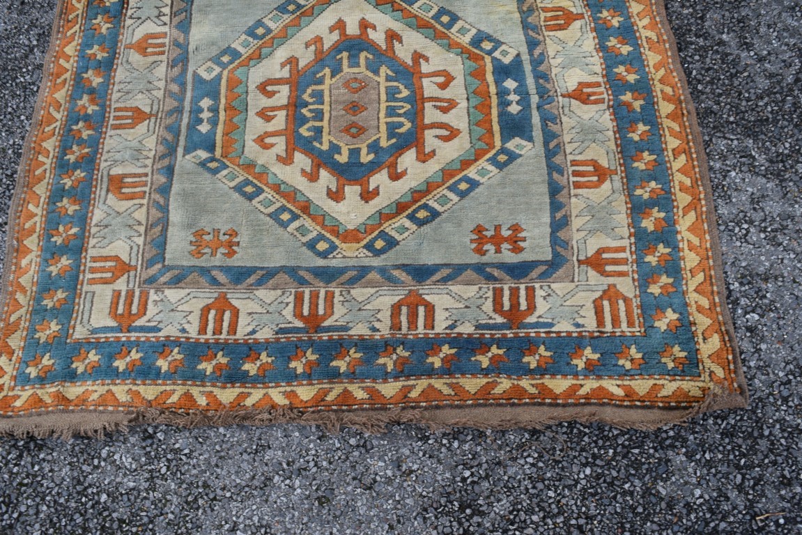 A Turkish Kars rug, with two large repeated geometric medallions and geometric design borders, - Image 6 of 8