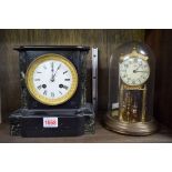 A late Victorian slate and marble mantel clock,