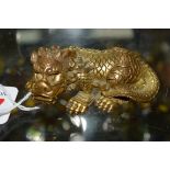 A Chinese gilt bronze Buddhistic lion, finely cast and with good details, 7.5cm long.