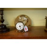 An antique brass timepiece, (dial a.f.); together with another Art Deco timepiece, 21.5cm wide.