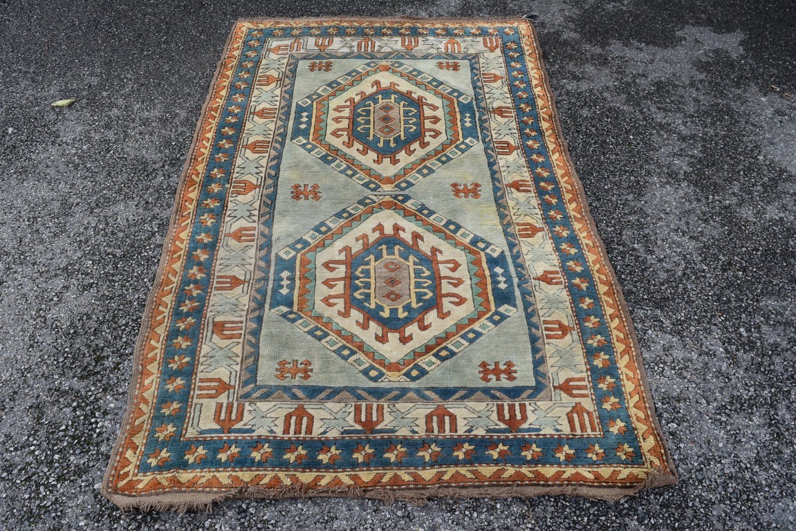 A Turkish Kars rug, with two large repeated geometric medallions and geometric design borders, - Image 2 of 8