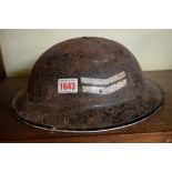 A World War II Air Warden's tin helmet.