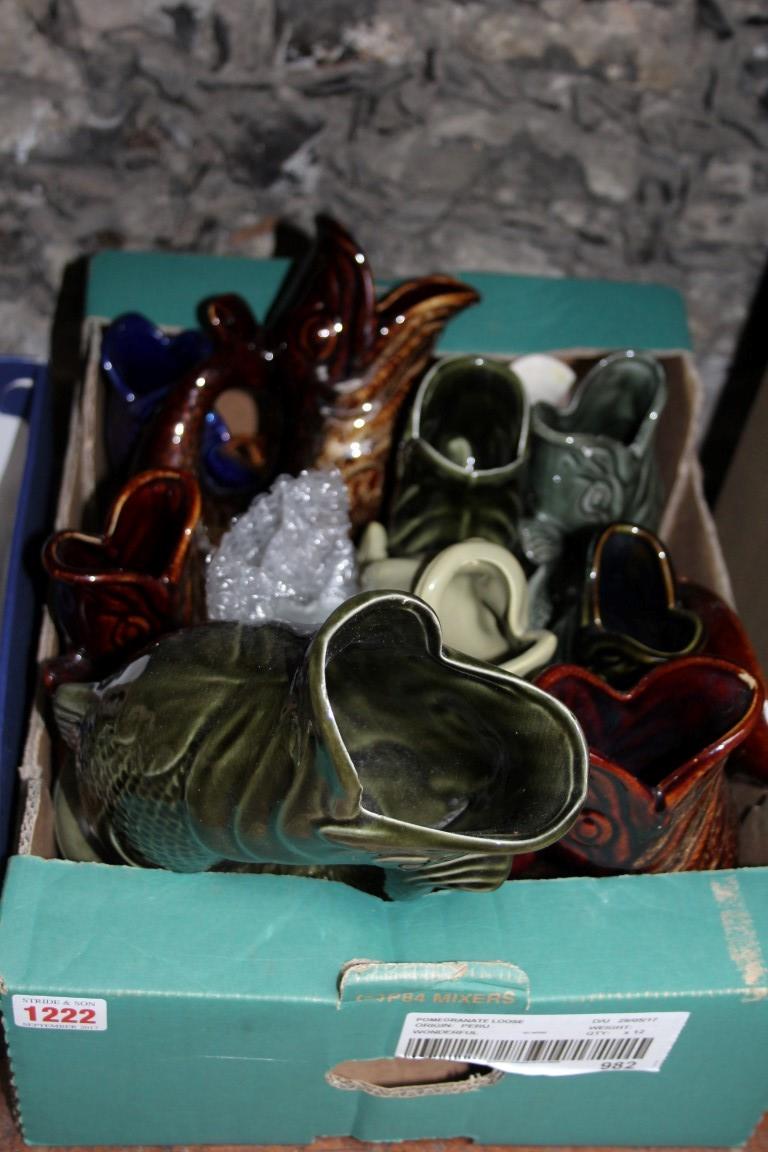 A collection of pottery fish vases.