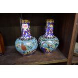 A pair of Chinese cloisonne enamel vases, 20.5cm high, (one dented).